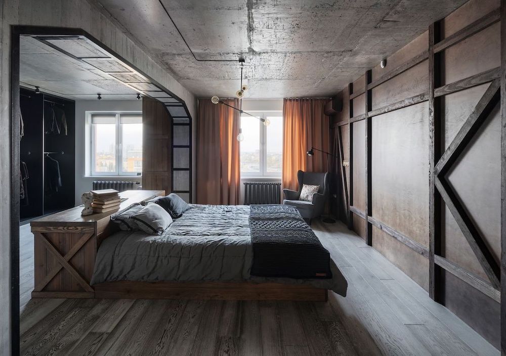 Sypialnia w stylu industrialnym z betonowym sufitem